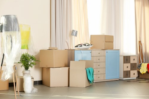 Team of movers loading household items for a same day removal in Notting Hill