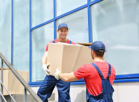 A professional team handling office equipment during a Notting Hill move