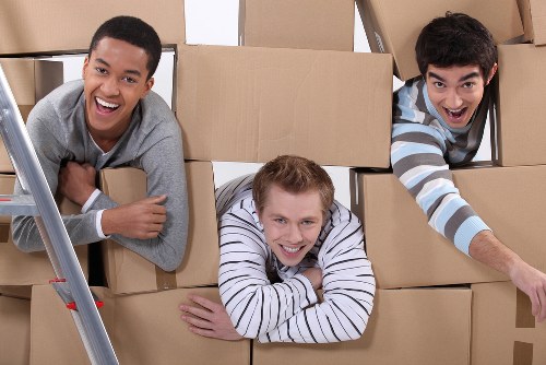 Careful loading of household items into a Notting Hill removal van