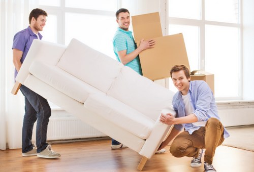 Careful packing of fragile household items by movers in Nottinghill