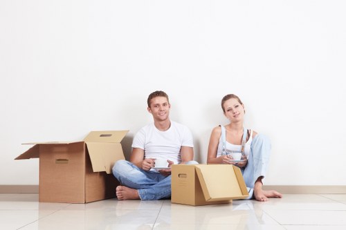 Professional removal team moving boxes in Notting Hill