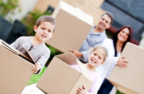 Local removals crew preparing bulky furniture for transport in Notting Hill