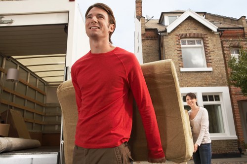 Moving team loading furniture carefully for Nottinghill house removals