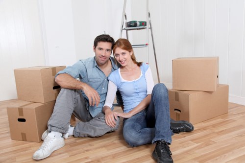 Careful packing for home moves in Nottinghill with labelled boxes