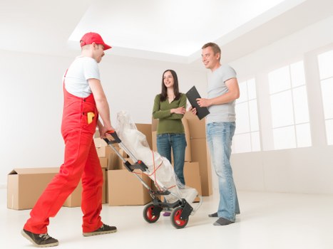 Furniture being carefully loaded for flat removals in Nottinghill