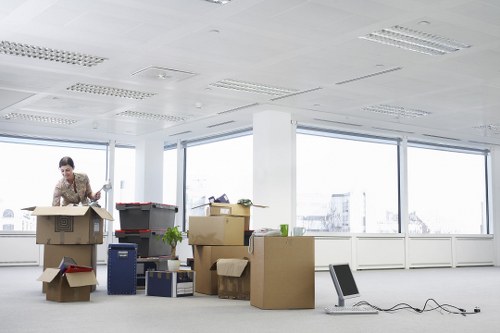 Removal staff using safe lifting practices during a move