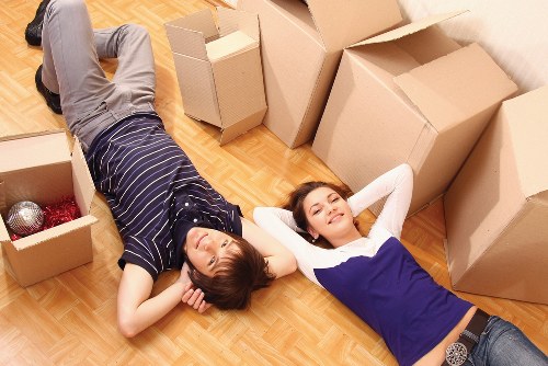 Team preparing a removal van with secured furniture and boxes